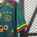 Camiseta hombre Ajax Bob Marley edición especial verde temporada 2025 2026 calidad 1.1 oficial, Ajax Bob Marley verde, Camiseta Ajax 2025, Camiseta Ajax Three Little Birds verde, Camiseta especial Ajax hombre, Calidad 1.1 Ajax, Tienda Hincha Futbolero, Eredivisie 2026, Bloke Core Ajax, Regalo hombre Bob Marley, Jersey Ajax Marley green.
