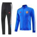 Chándal hombre Manchester United temporada 2025 2026 conjunto sudadera azul y pantalón largo negro calidad 1.1 premium oficial.