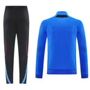 Chándal hombre Manchester United temporada 2025 2026 conjunto sudadera azul y pantalón largo negro calidad 1.1 premium oficial.