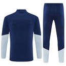 Conjunto hombre Real Madrid temporada 2026 2027 oficial sudadera azul marino pantalón largo fútbol técnica transpirable entrenamiento galáctico Bernabéu.