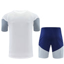 Conjunto hombre Real Madrid temporada 2026 2027 oficial camiseta blanca y pantalón corto azul marino fútbol técnica transpirable entrenamiento galáctico Bernabéu.