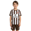 Conjunto infantil fútbol FC St. Pauli temporada 2025 2026 oficial primera equipación camiseta marrón y pantalón técnica transpirable kids calavera.